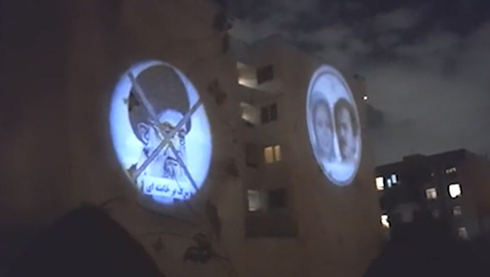 Images of Massoud Rajavi and Maryam Rajavi projected in saadat abad