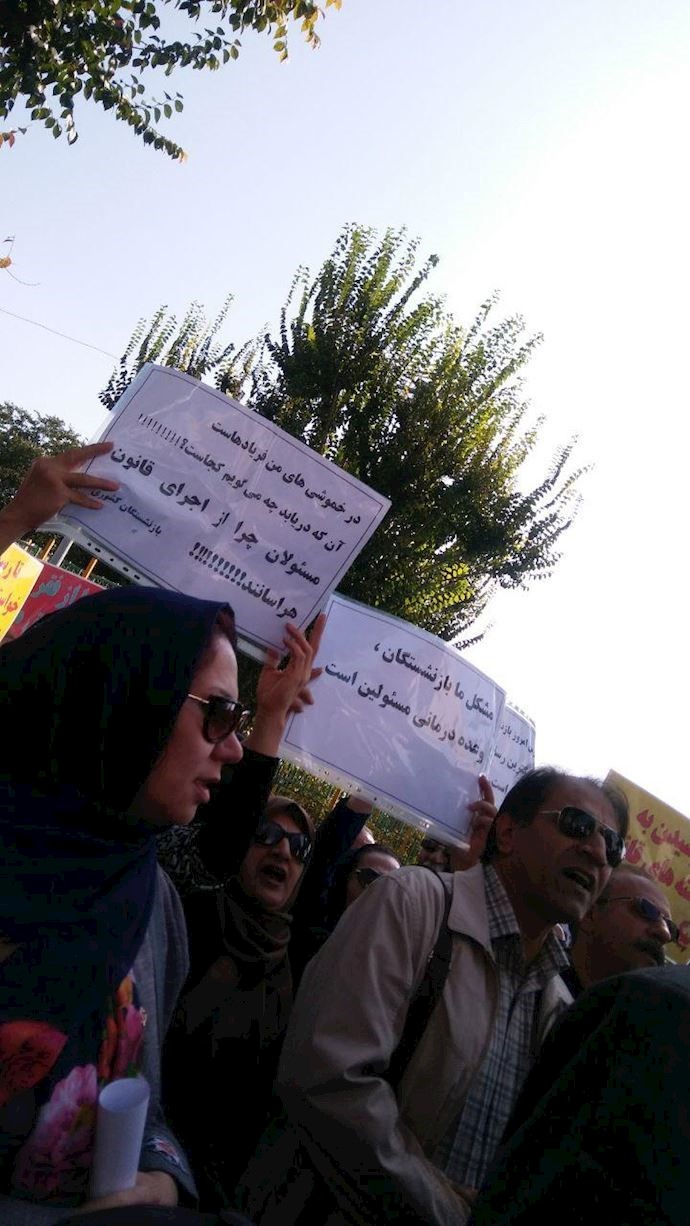 Sign reads: “Why are officials terrified of upholding the law?”