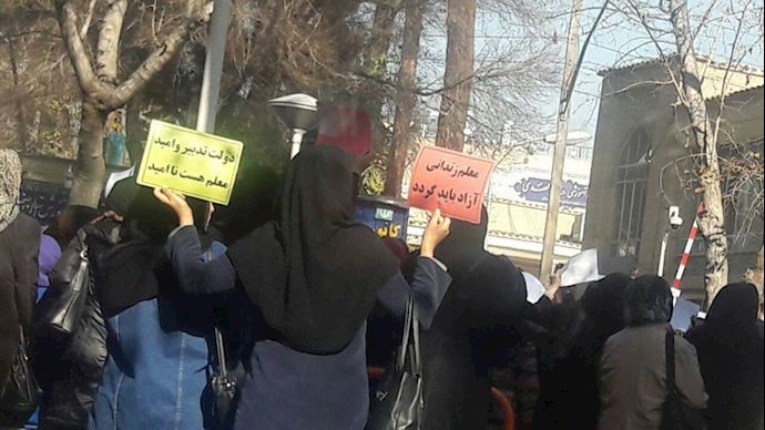 The teachers were holding up various signs reading