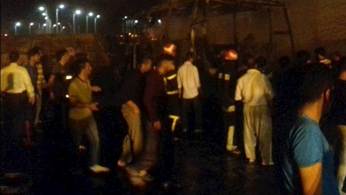 People at the scene of the Sanandaj bus-truck accident People at the scene of the Sanandaj bus-truck accident