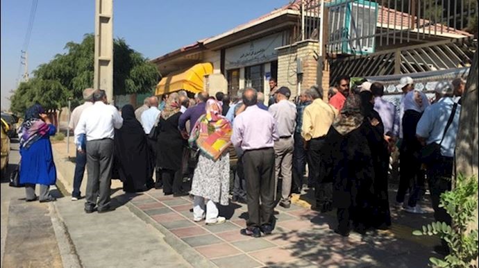 Members of a trade union in Tehran holding a protest rally