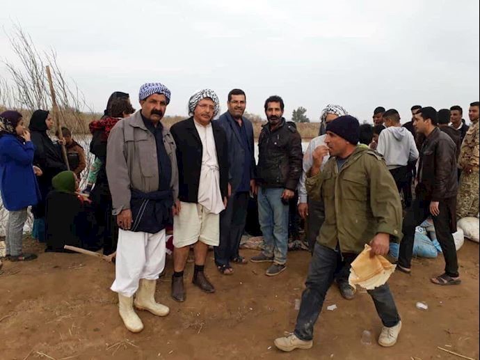 The people of Rafi are helping each other create flood dams.