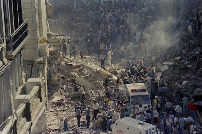 Firemen and rescue workers walk through the debris of Israels Embassy after a terrorist in Buenos Aires, Argentina, March 17,1992 