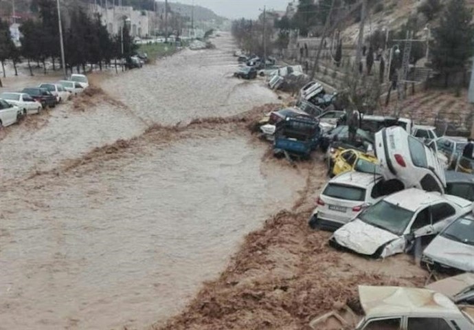 Vehicles are stacked one against another after a flash flooding In Shiraz, Iran, March 25, 2019