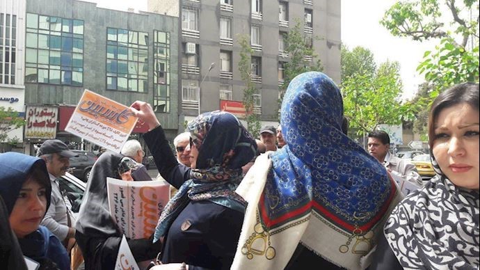 More men and women standing all day to demand their money back from the IRGC-linked Caspian financial institution – Tehran, Iran – April 16, 2019