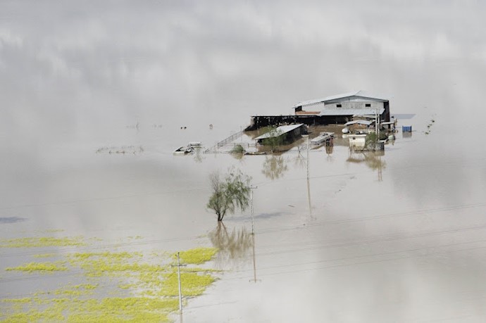 An aerial view shows a house in floods in Golestan province