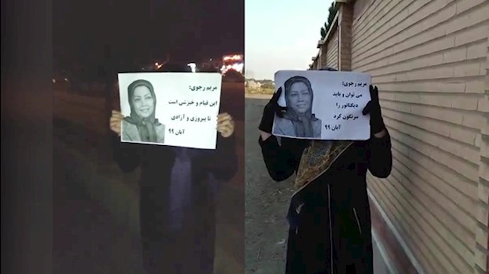 Iranian women hold up images of President-elect of the National Council of Resistance of Iran (NCRI) Maryam Rajavi