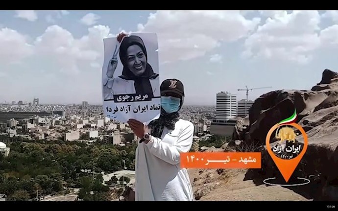 Mashhad July 10, 2021 – A woman holds an image of the Iranian Opposition leader Maryam Rajavi Mashhad July 10, 2021 – A woman holds an image of the Iranian Opposition leader Maryam Rajavi