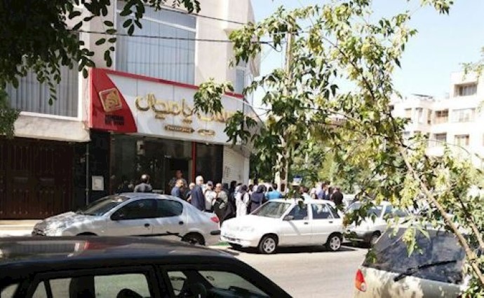  'Clients of the Caspian credit firm holding a protest rally in Mashhad, northeast Iran'